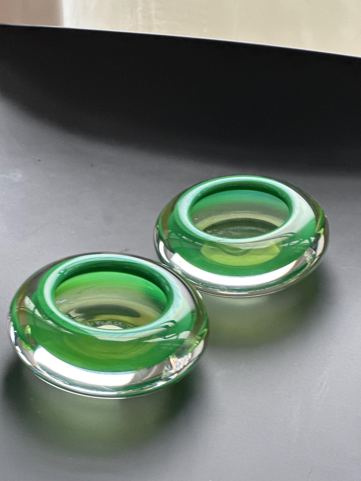 Hanne Dreutler Studio Åhus 2000 signed Swedish studio glass votive holders. Clear cased glass with emerald core, sculptural modern design.