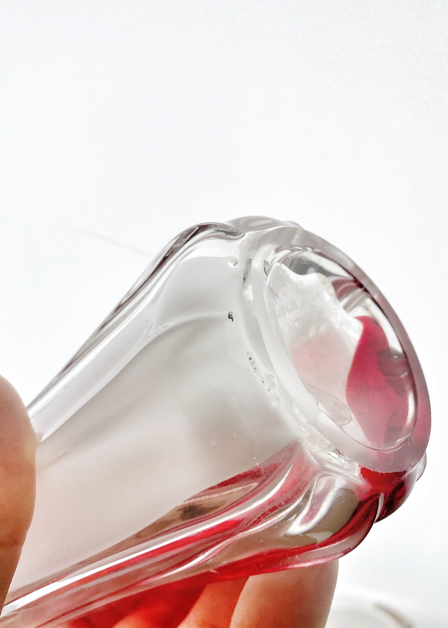 A Murano Art Glass vase, organic form, clear with white, and red tint