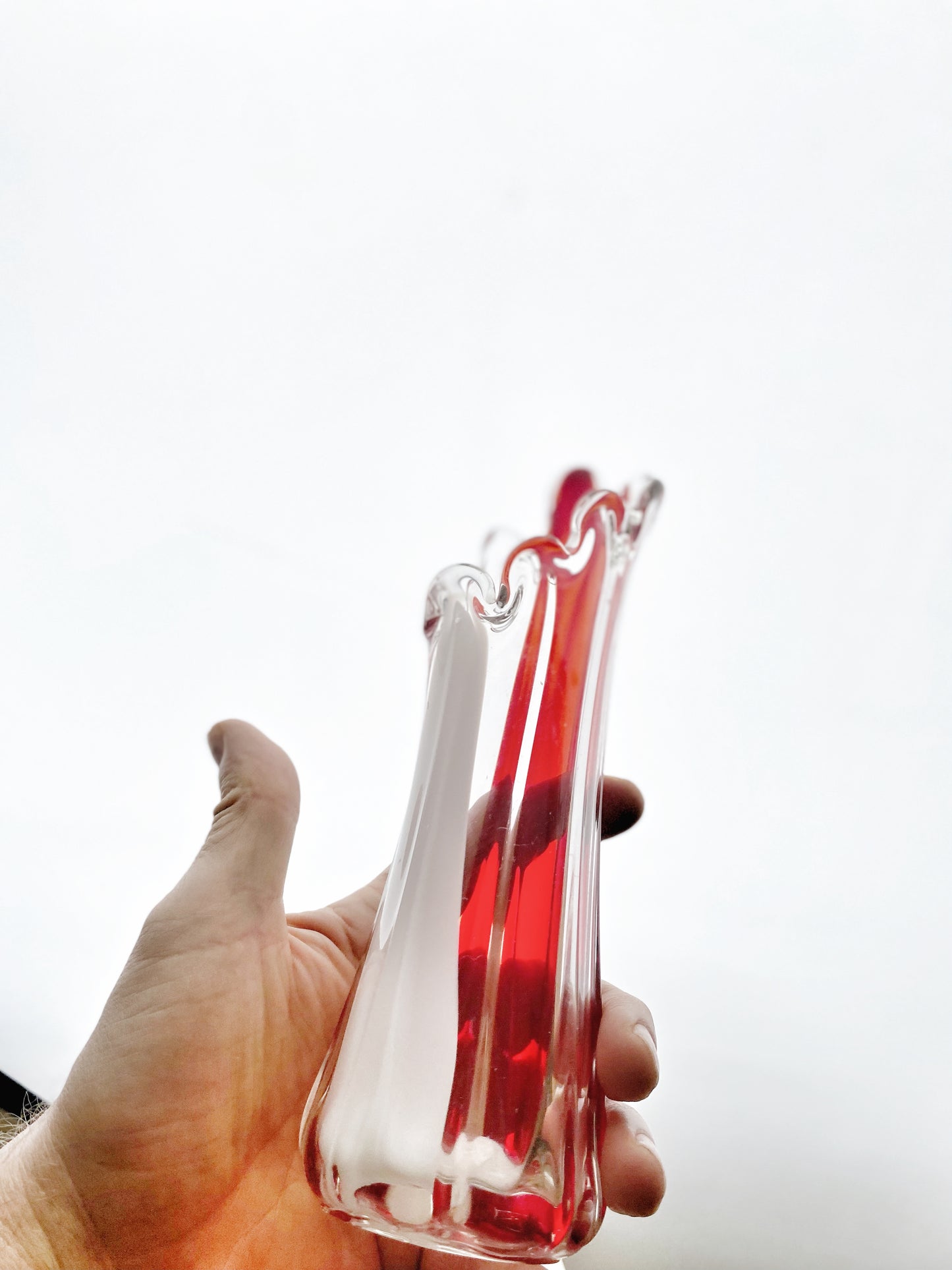 A Murano Art Glass vase, organic form, clear with white, and red tint