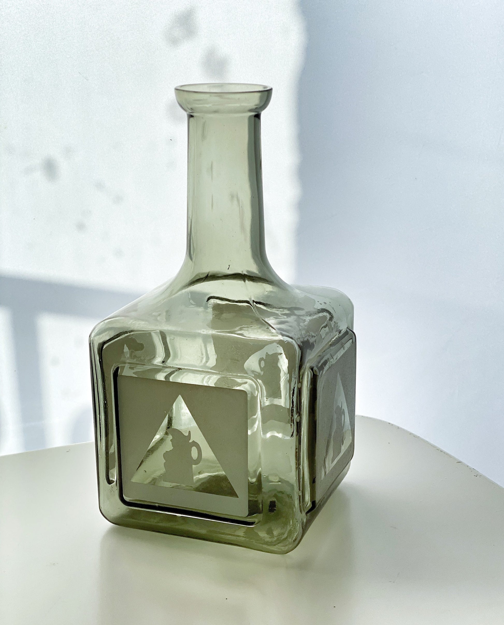 1970s Bass Charrington smoked glass bottle. With frosted ‘Toby Jug’ logo.