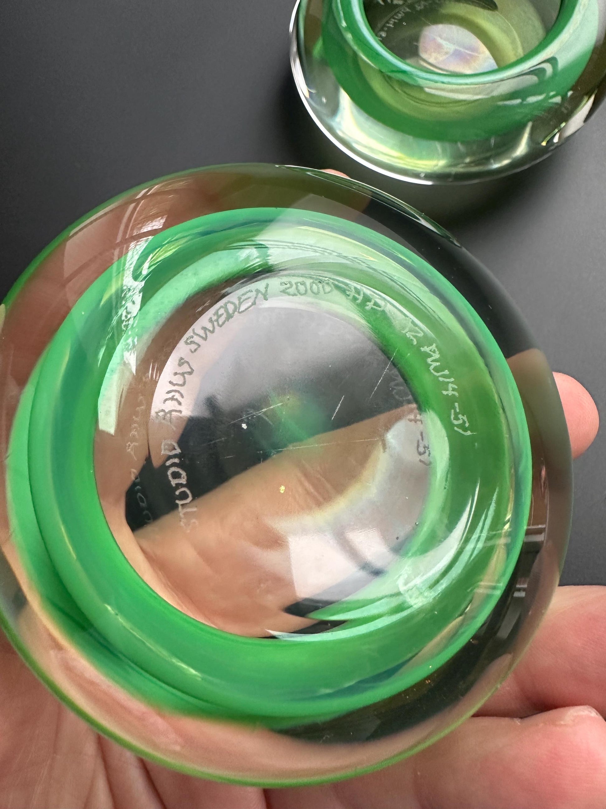 Hanne Dreutler Studio Åhus 2000 signed Swedish studio glass votive holders. Clear cased glass with emerald core, sculptural modern design.