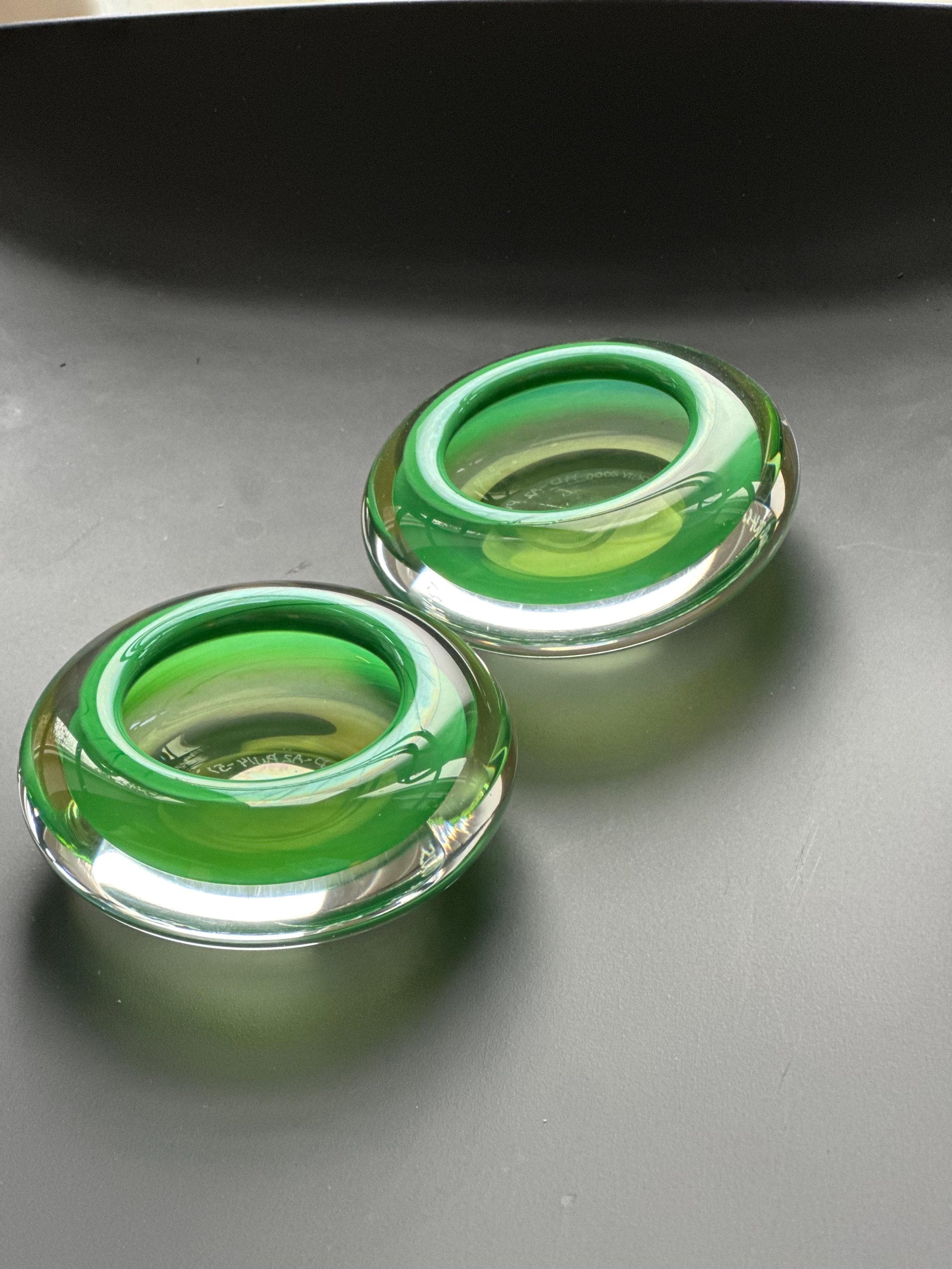 Hanne Dreutler Studio Åhus 2000 signed Swedish studio glass votive holders. Clear cased glass with emerald core, sculptural modern design.