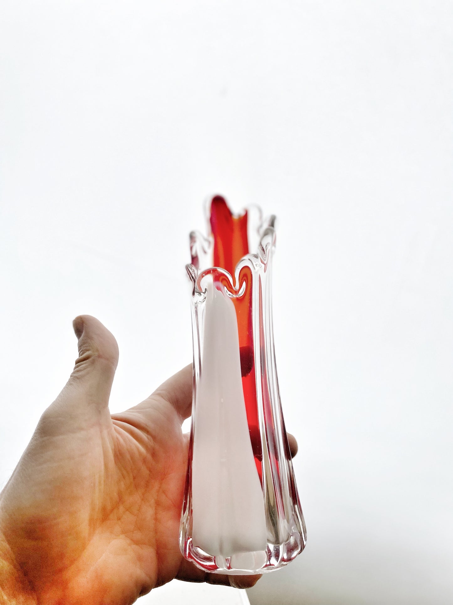 A Murano Art Glass vase, organic form, clear with white, and red tint